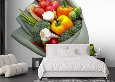 edible bouquet of vegetables for man, in green package with green ribbon, surprise, a snack made from red and yellow peppers, tomatoes, chili pepper, broccoli and Brussels sprouts and garlic. isolated Wall mural