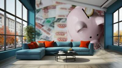 piggy bank, money Russian banknotes of dignity five thousand, one thousand rubles, metal coins 10, 5, 2, 1 ruble background, concept Wall mural