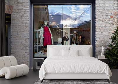 Exterior shop window display with female winter clothing and accessories, Christmas decoration. Xmas sale Wall mural