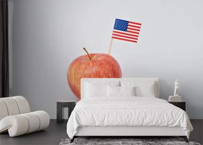 Ripe red apple and small American flag canape on white background. Greeting card for celebration of President's Day in America concept Wall mural