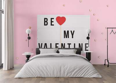 Valentine's day greeting card with light box text Be My Valentine love confession with wooden red heart stick, pink background Wall mural