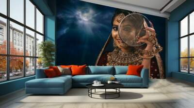 Young Indian female in ethnic Indian wear celebrating festival of Diwali. Indian female with bridal make-up and bridal wear Wall mural