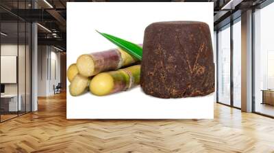 Organic Jaggery ( unrefined sugar ) and sugarcane isolated on white background. Wall mural