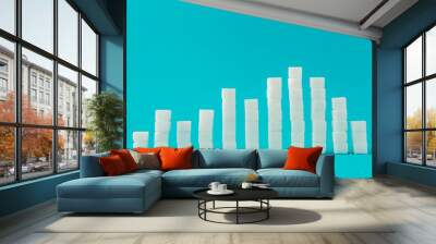 Financial chart made of sugar cubes with blue background. Sugar consumption growth rate world market concept. Wall mural