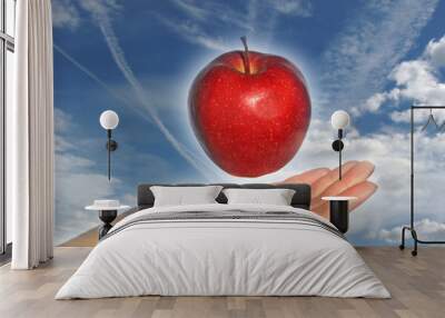 apple above a hand - 2 Wall mural