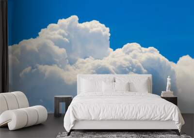 Cumulus white clouds on blue sky close up Wall mural