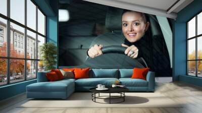 young pretty woman driving car Wall mural