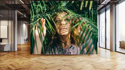 the girl in foliage Wall mural