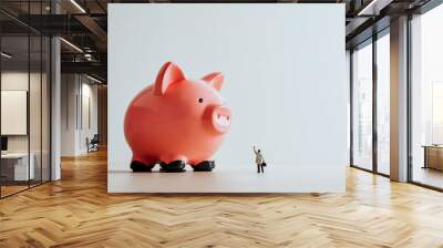 Lonely businessman and Piggy Bank. Business concept Wall mural