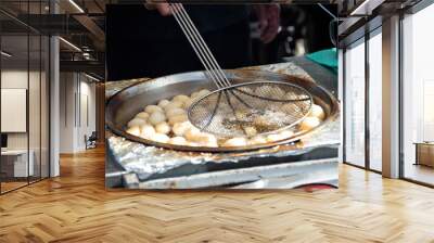 Loukoumades (Greek/Cypriot donuts with honey) cooked at village fair in Cyprus Wall mural