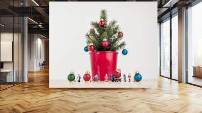 miniature people decorating giant christmas tree Wall mural