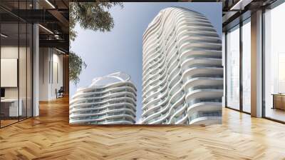 Modern high rise apartment building exterior with wavy balconies reaching up to the sky. Limassol, Cyprus Wall mural