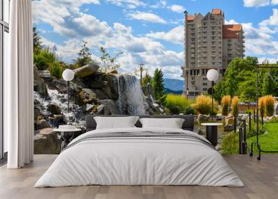 A landscaped waterfall and pond in the public McEuen Park near the resort in the lakeside town of Coeur d'Alene Idaho USA Wall mural