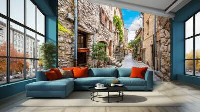 A picturesque back street of homes and apartments in the medieval village of Tourrettes Sur Loup in the Alpes_Maritimes area of Southern France. Wall mural