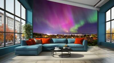 Late night view of the Aurora Borealis Northern Lights seen from a hillside subdivision in Liberty Lake overlooking the skyline and cities of Spokane and Spokane Valley, Washington State, USA. Wall mural