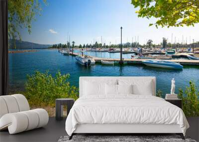 The marina and city beach area of downtown Sandpoint, Idaho, with boats filling the docks on Lake Pend Oreille on a summer day in the Idaho panhandle. Wall mural