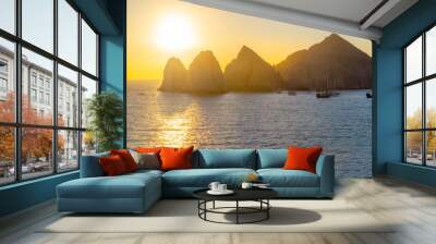 The morning sun appears over the El Arco coastal rocks at the Mexican port city of Cabo San Lucas, Mexico.  Wall mural