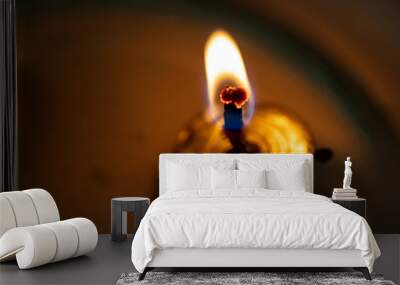 Candle light on fire burning low Wall mural