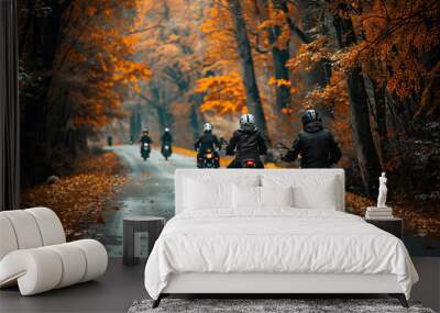 A group of motorcyclists riding through a scenic autumn forest with vibrant orange and yellow foliage, capturing the camaraderie and adventure of a fall motorcycle tour. Wall mural