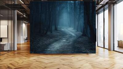 A misty path winds through a dense, haunted forest under a ghostly moonlit sky, creating a sense of foreboding. Wall mural