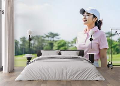 Confident Female Golfer Enjoying a Sunny Day on the Golf Course Wall mural