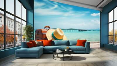 luggage and summer hat on the beach, vacation and travel concept Wall mural