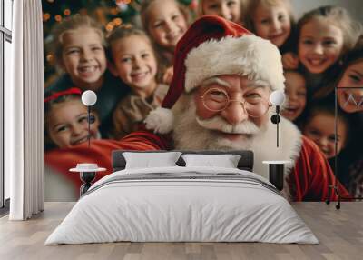 santa claus taking a festive selfie with a group of delighted children, spreading joy and laughter d Wall mural