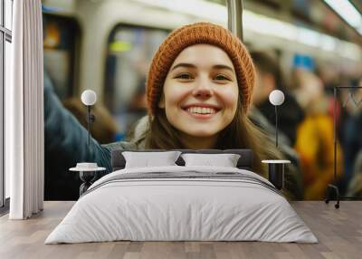 Below view of a happy woman looking up at the electronic display inside a subway car, excited about his journey. Ai generated Wall mural