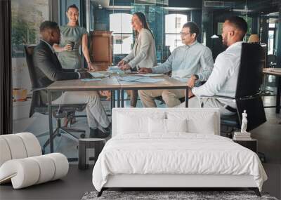 Business meeting in a boardroom of colleagues talking and planning company growth strategy together. Group or team of diverse and happy employees having a discussion in a modern office Wall mural