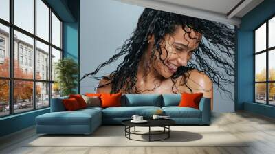 Wet hair, happiness and woman beauty after shower dancing from haircare and wellness. Young female model, smile and dance with happy face and dermatology from grooming care and shampoo treatment Wall mural