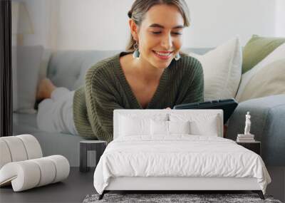 Woman, digital tablet and living room app, typing and reading ebook, online shopping and 5g multimedia technology on sofa home lounge. Relax girl on social media, internet website and wifi connection Wall mural