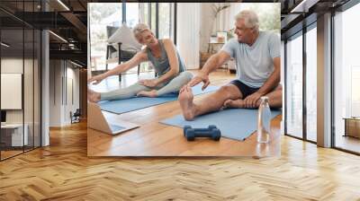 Stretching, fitness and senior couple with workout on the internet together on the living room floor. Happy, calm and healthy elderly man and woman training for wellness with exercise video on web Wall mural