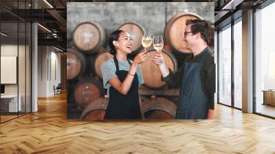 Wine, glass and toast with a couple who drink alcohol in a cellar, distillery or winery estate together. Farming, collaboration and teamwork with a man and woman drinking and doing a cheers as a team Wall mural