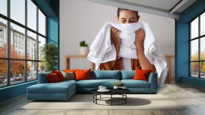 Laundry, fresh and woman smelling a towel after cleaning, housework and washing clothes in the morning. Chores, housekeeping and cleaner with smell of clean clothing after a routine wash at home Wall mural