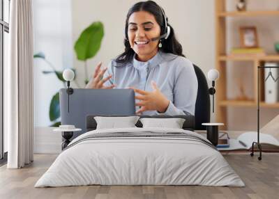 Video call, laptop and seminar with a business indian woman meeting online while sitting in her office at work. Remote work, headset and communication with a female employee talking in a webinar Wall mural