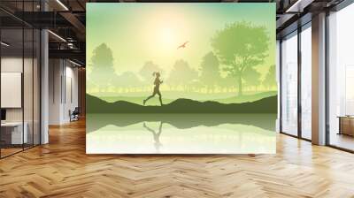 Female jogging in the countryside Wall mural