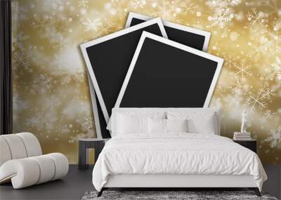 Polaroids on dolden background of falling snowflakes Wall mural