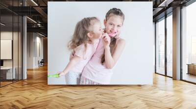 Two Cute pretty little child brushing teeth Wall mural