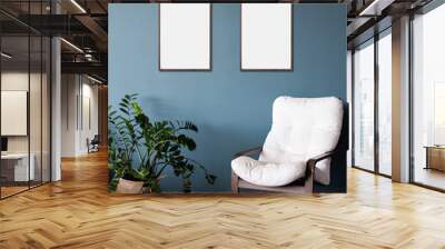 Blank picture frame mockup on blue wall. Modern living room design. View of modern scandinavian style interior with chair. Home staging and minimalism concept Wall mural