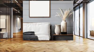 Blank picture frame mockup on gray wall. Artwork in interior design. View of modern rustic style interior with wooden sofa and empty canvas for painting or poster on wall. Minimalism concept Wall mural