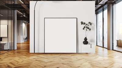 Blank picture frame mockup on white wall. White living room design. View of modern scandinavian style interior with artwork mock up standing on floor. Home staging and minimalism concept Wall mural