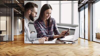 Business people working together in boardroom, brainstorming, discussing and analyzing business strategy. Young professionals working in office, Colleagues using digital tablet in coworking. Wall mural