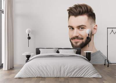 Closeup portrait of handsome smiling young man. Laughing joyful cheerful men studio shot. Isolated on gray background Wall mural