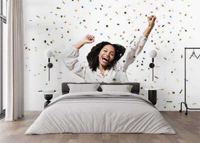 Happy woman with confetti falling everywhere on her isolated transparent PNG, Birthday celebration party or New Year eve celebrating concept Wall mural