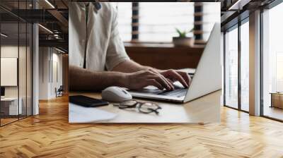 Man hands typing on computer keyboard closeup, businessman or student using laptop at home, online learning, internet marketing, working from home, office workplace freelance concept Wall mural