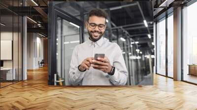 Man professional using smartphone in office. Businessman working, texting mobile phone. Communication, connection, business, people, technology concept Wall mural