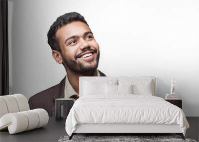 Portrait of handsome smiling young man looking up isolated in transparent PNG. Laughing joyful cheerful men studio shot Wall mural