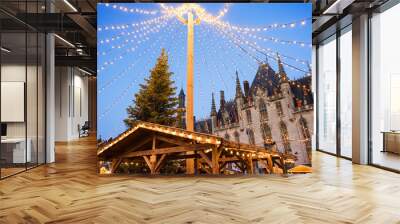 Traditional Christmas market in Europe, Bruges, Belgium. Main town square with decorated tree and lights. Christmas fair concept Wall mural