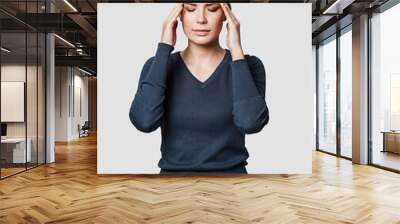 Young beautiful woman has headache isolated studio portrait Wall mural