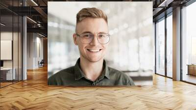 Young handsome man portrait, Cheerful laughing businessman smiling indoor, People, enjoy life, student lifestyle, office life, business concept Wall mural